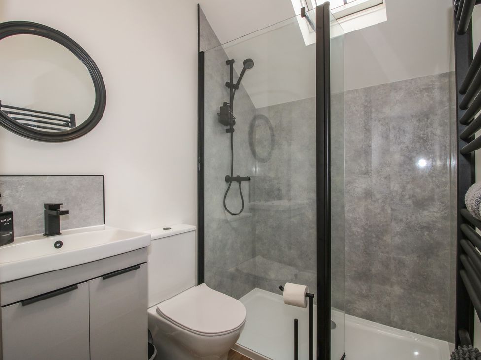 A bathroom with shower, toilet, and sink at Chestnut Barn in Northwood near Wem