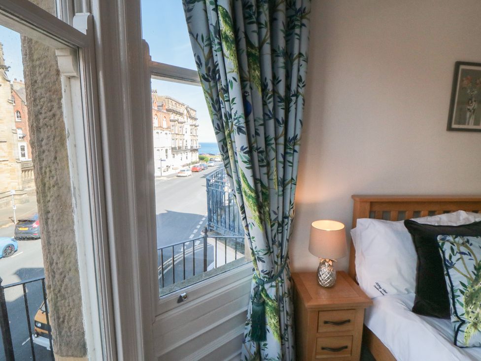 A bedroom with a window and bed at Stanton House - Abbey View, Flat 3