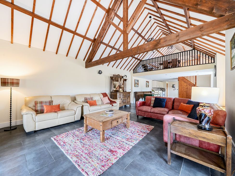 A living room with sofas and a coffee table at The Dairy in Corwen