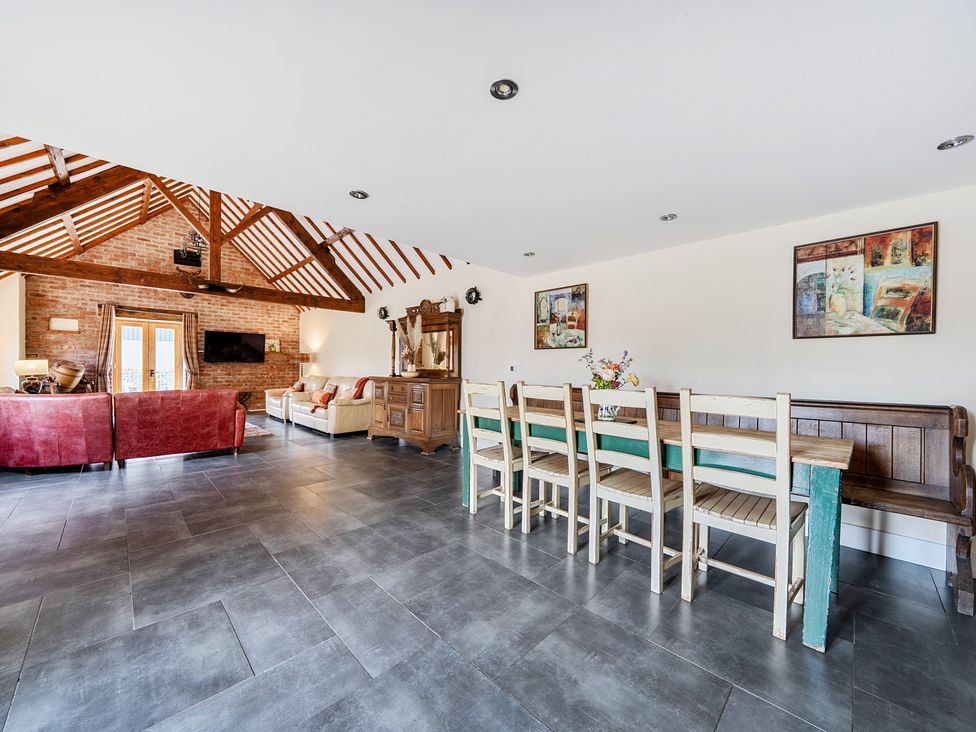 A dining room with a dining table and chairs at The Dairy in Corwen