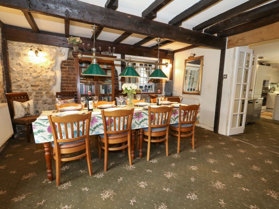 A dining room with a large table and chairs at Piddle Inn Piddletrenthide