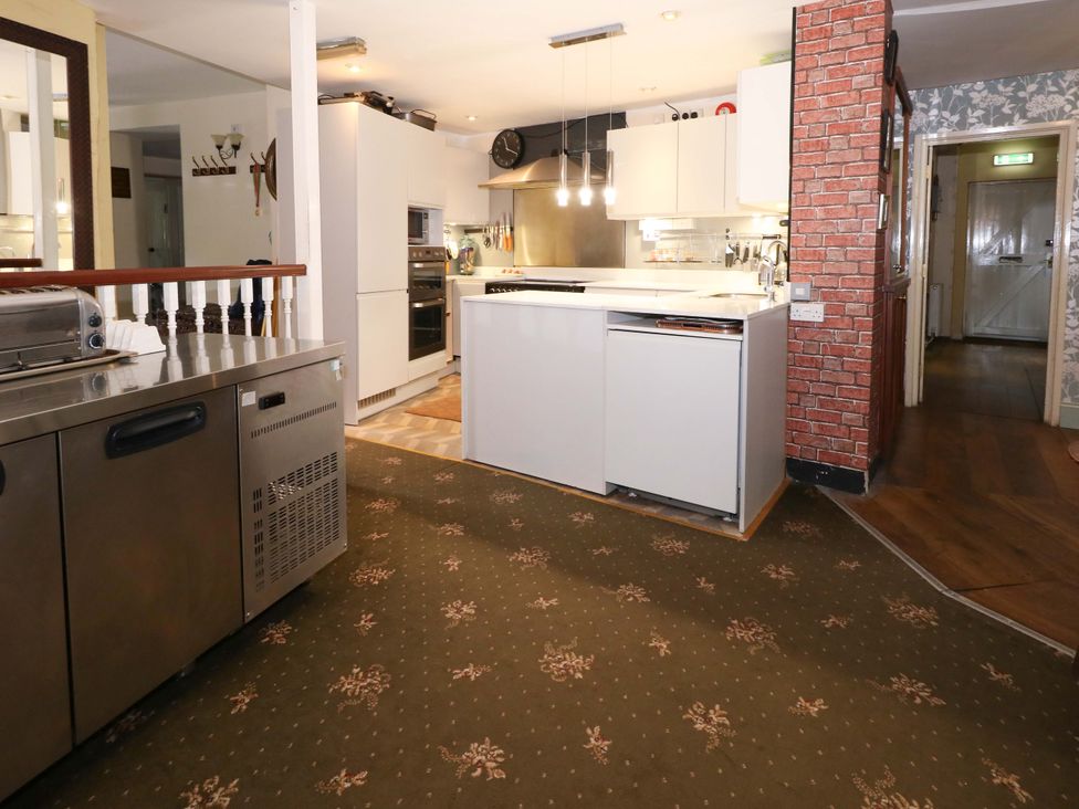 A kitchen with a stainless steel unit and appliances at Piddle Inn in Piddletrenthide