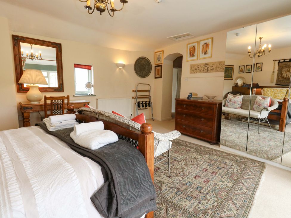 A bedroom with a bed and a chest of drawers at Piddle Inn in Piddletrenthide