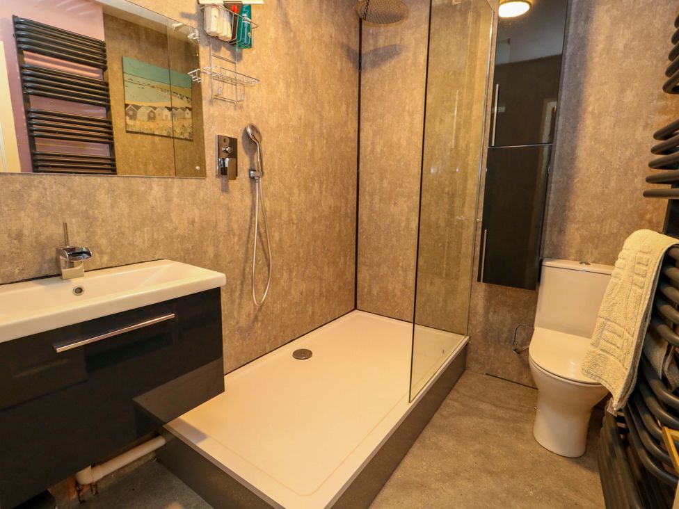 A bathroom with a shower and sink at Piddle Inn in Piddletrenthide