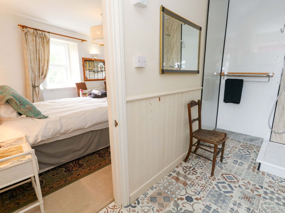 A bedroom with a bed and shower area at Piddle Inn in Piddletrenthide