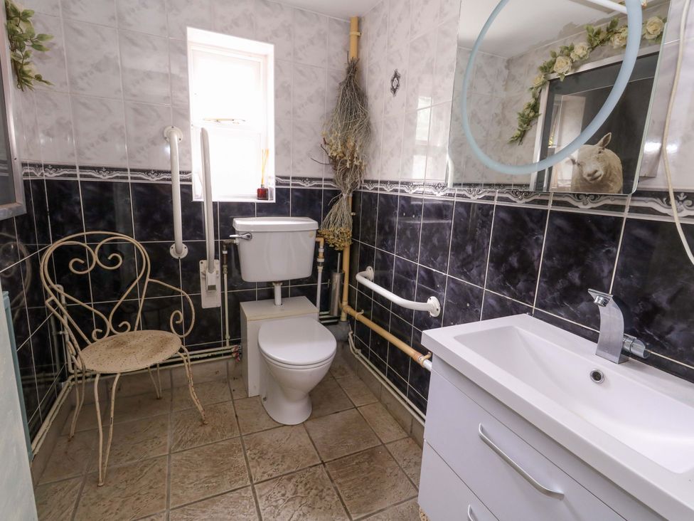 A bathroom with a toilet and sink at Piddle Inn in Piddletrenthide