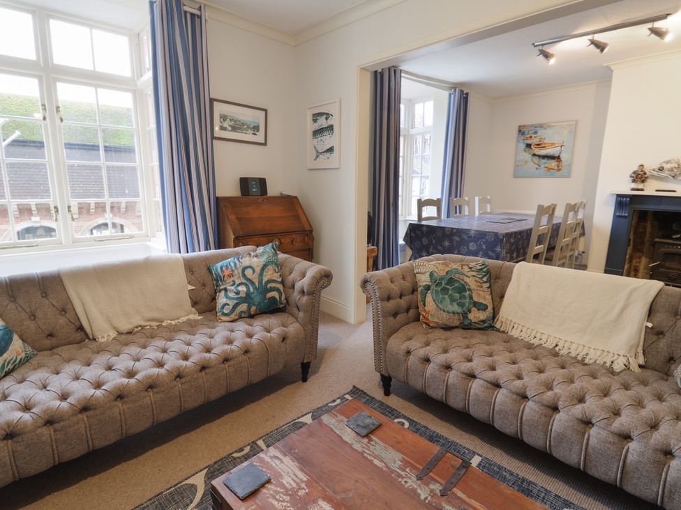 A living room with two sofas and a coffee table at 5B Bridge Street in Lyme Regis