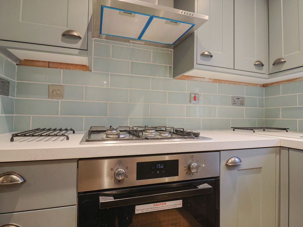 A kitchen with a gas stove and oven at 5B Bridge Street in Lyme Regis