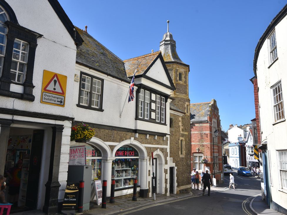 A street scene with buildings and people at 5B Bridge Street in Lyme Regis