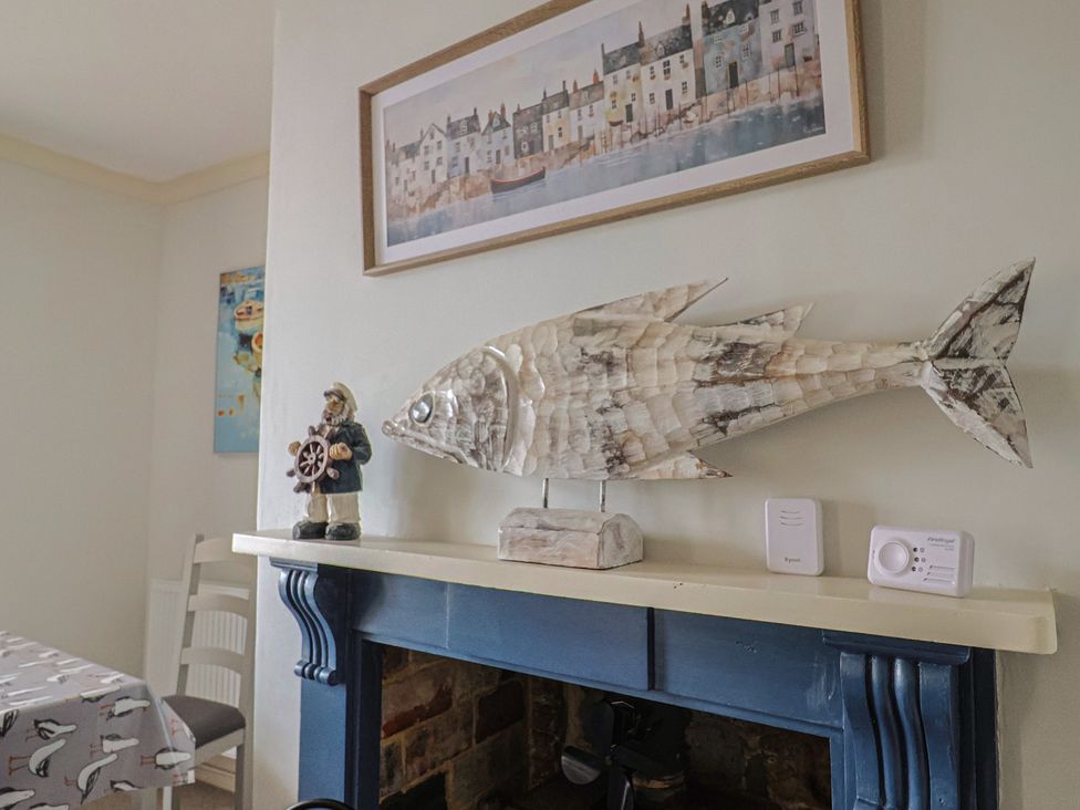 A dining room with fish decoration and a figurine at 5B Bridge Street in Lyme Regis