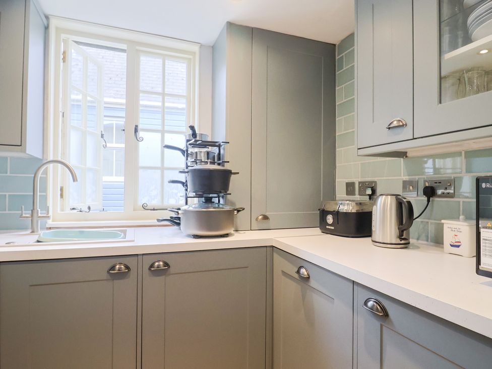 A kitchen with a sink and window at 5B Bridge Street Lyme Regis