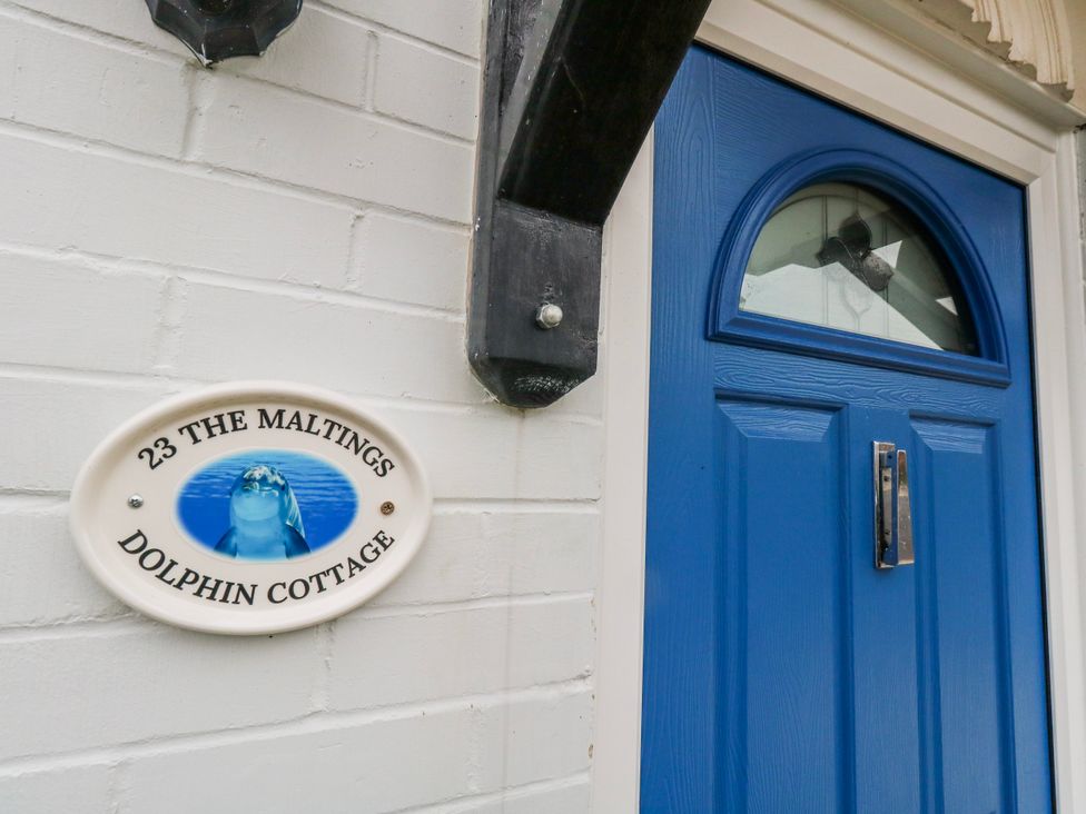 An entrance with a blue door and a nameplate at 23 The Maltings in Weymouth