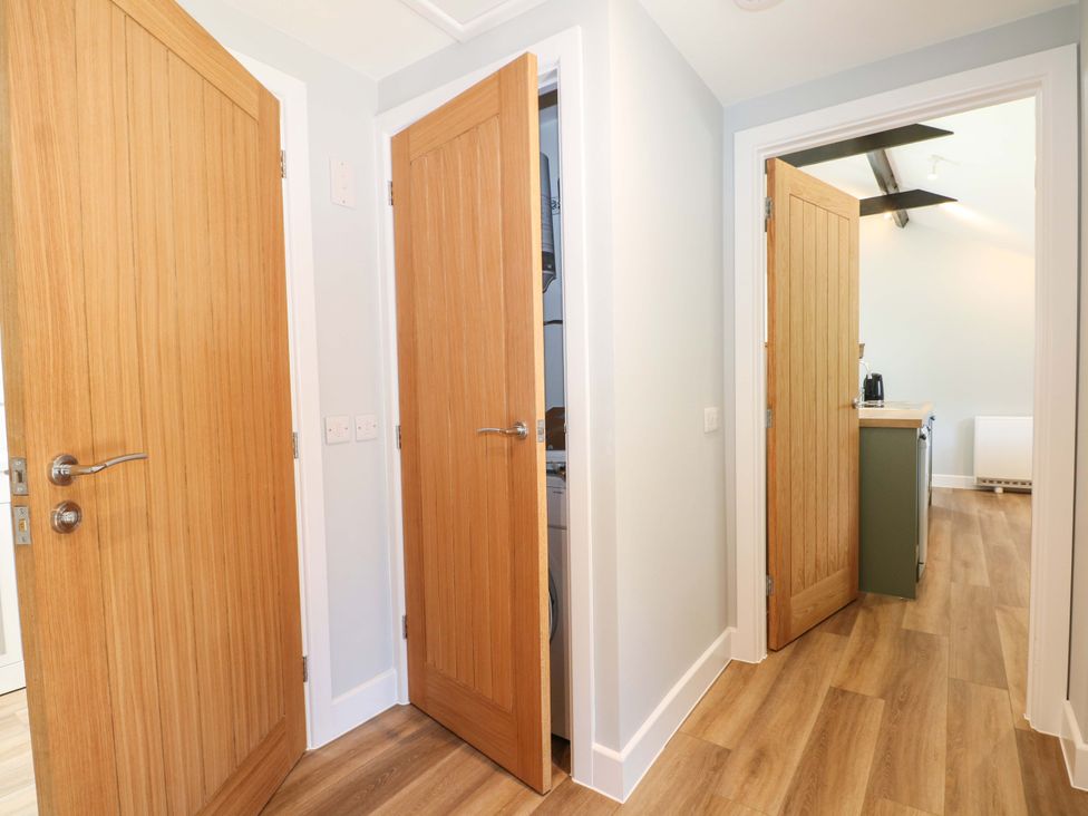 A hallway with multiple doors at The Old Parlour in Southampton