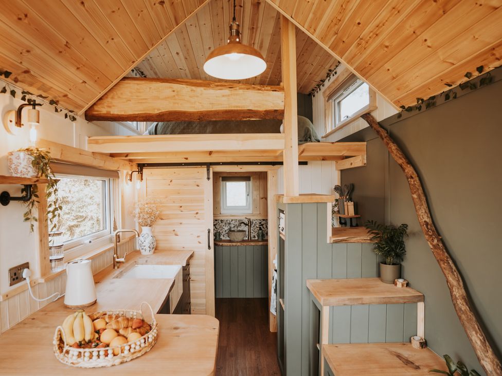 A kitchen with wooden counters and a sink at Rowan near Llanfechell