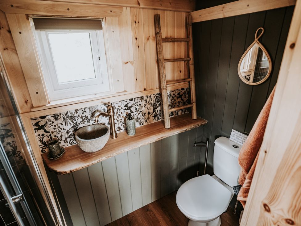 A bathroom with a sink and toilet at Rowan in Carreglefn near Llanfechell