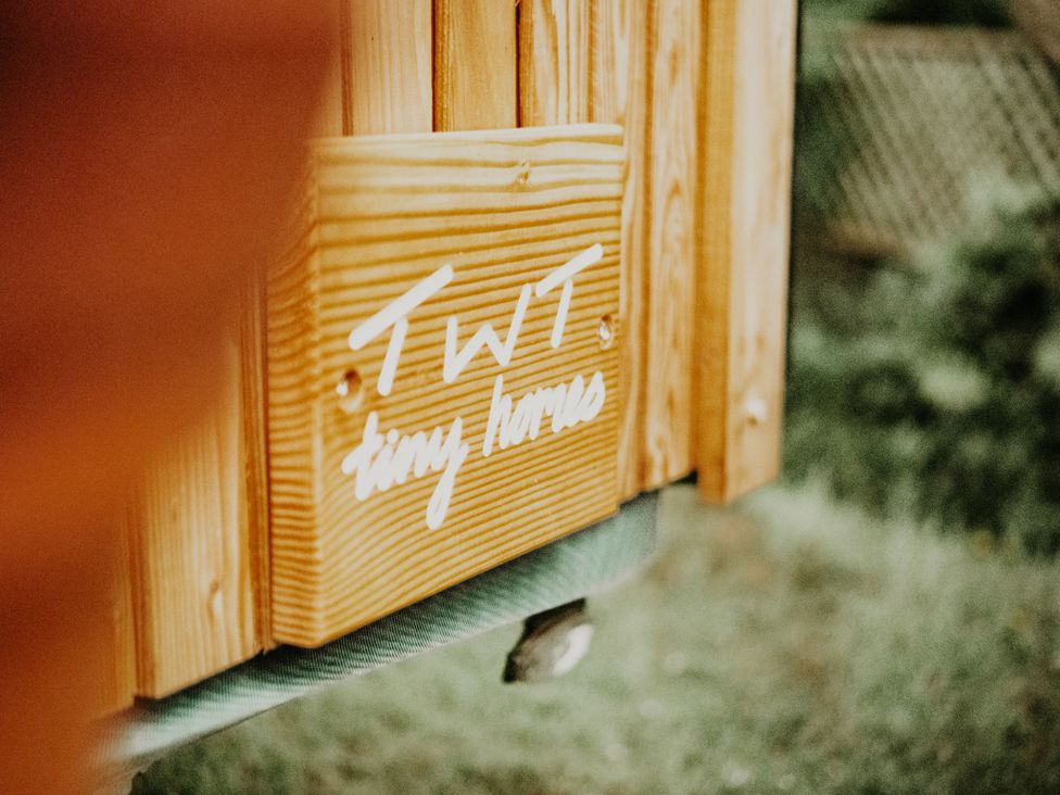 A sign for TWT tiny houses