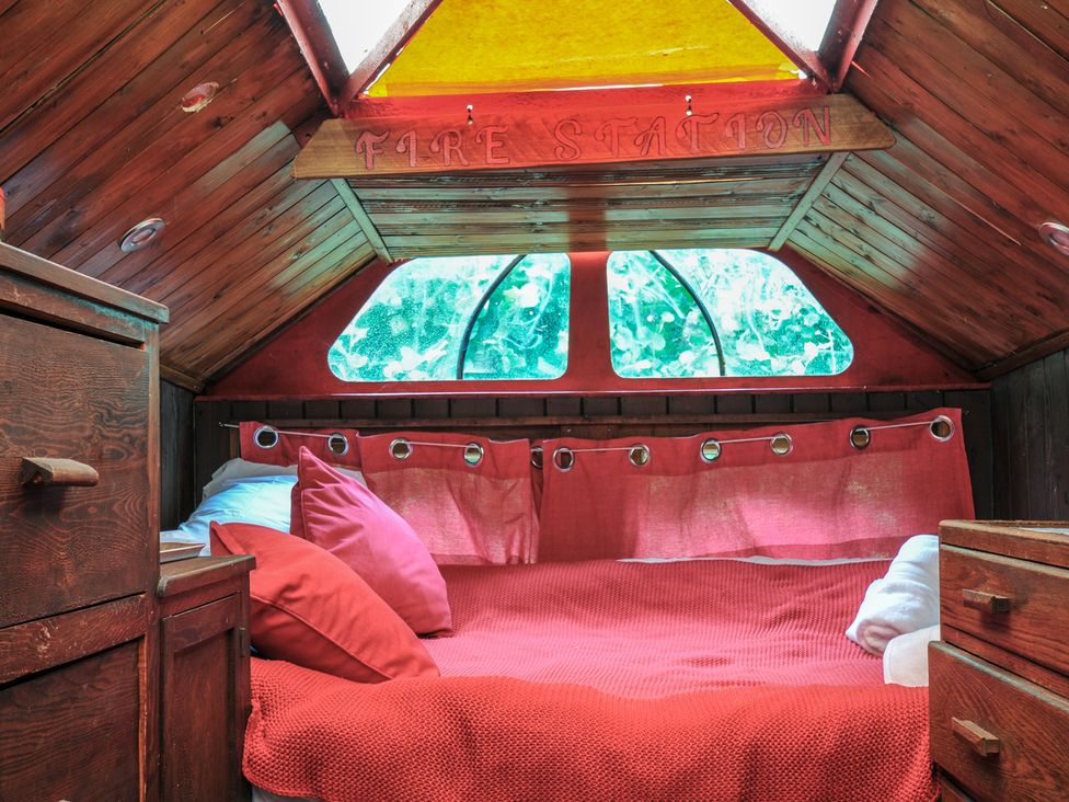 A bed with pillows in a small room at Dashing Dennis - 22 Chapmanswell near Launceston