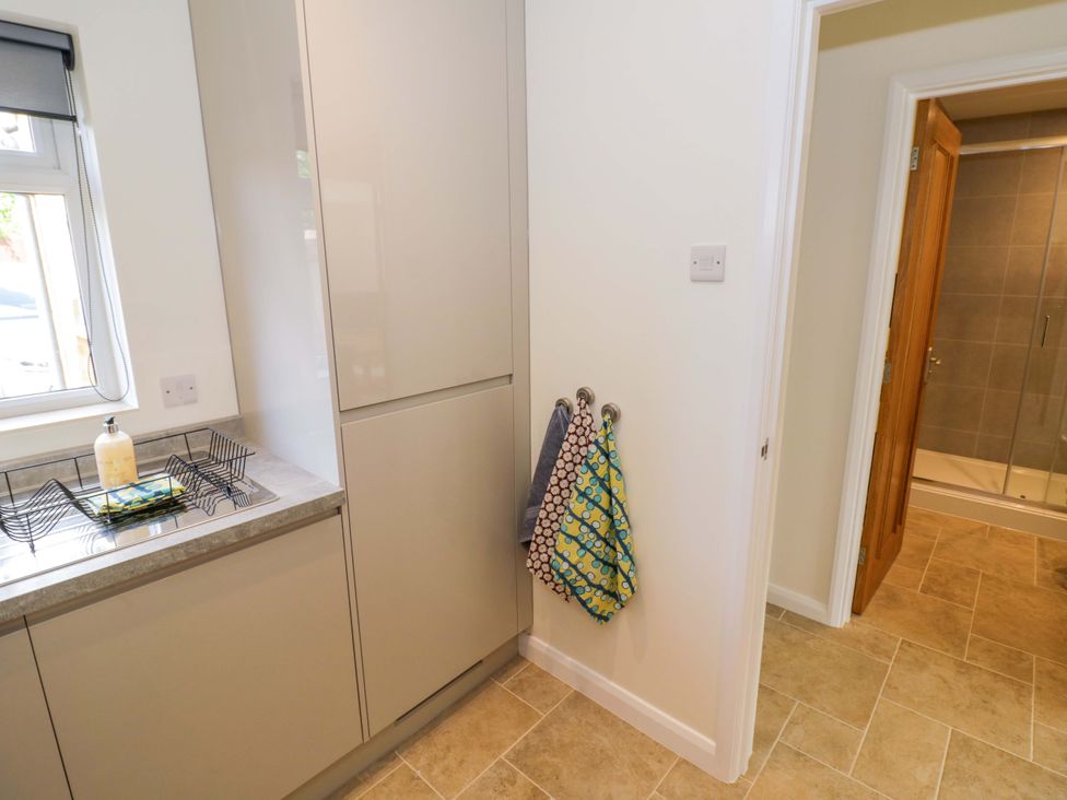 A kitchen with cabinetry and a sink at 22 Old Chapel Close in Kidlington