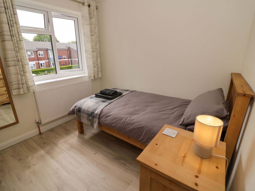 A bedroom with a bed and bedside table at 22 Old Chapel Close Kidlington