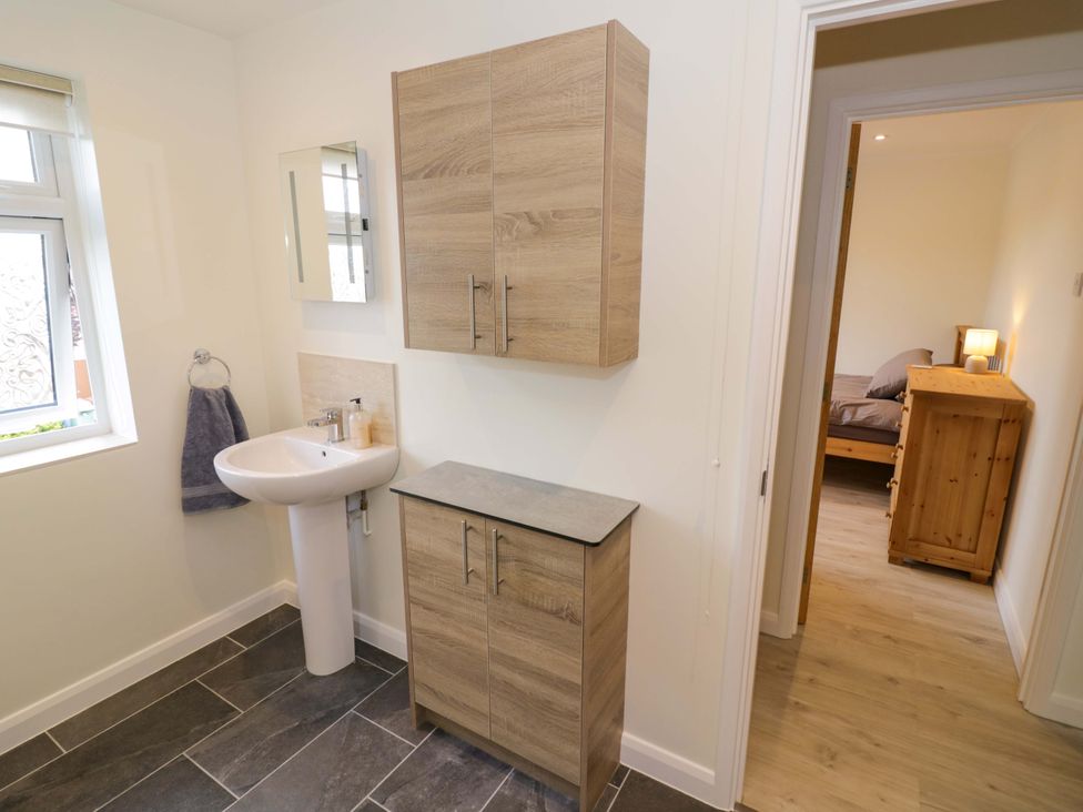 A bathroom featuring a sink and storage cabinet at 22 Old Chapel Close in Kidlington