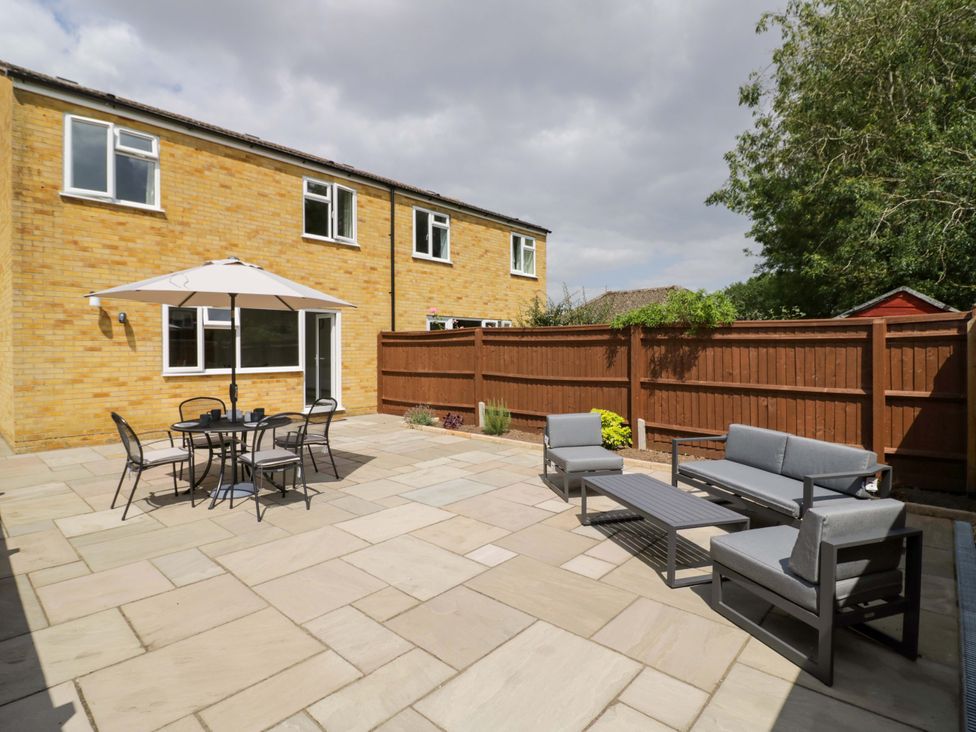 An outdoor area with seating and a table at 22 Old Chapel Close Kidlington