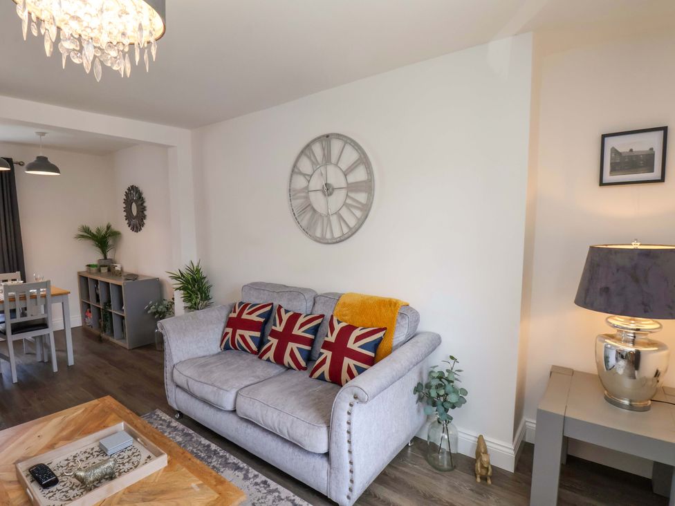 A living room with a sofa and coffee table at Postman’s Lodge in Middlesbrough