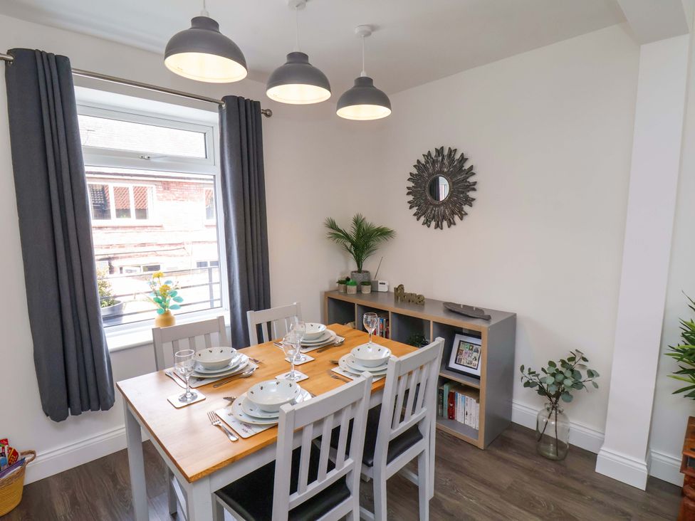 A dining room with a table and chairs at Postman’s Lodge in Middlesbrough