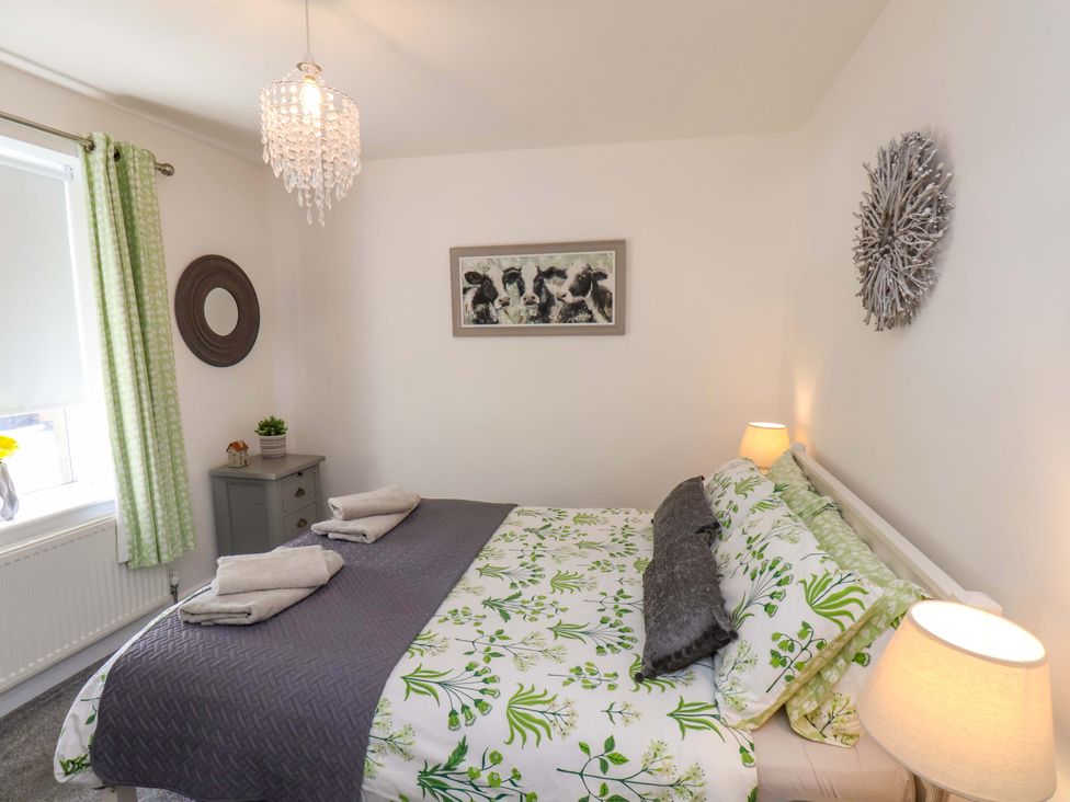 A bedroom with a bed and bedside furniture at Postman’s Lodge in Middlesbrough