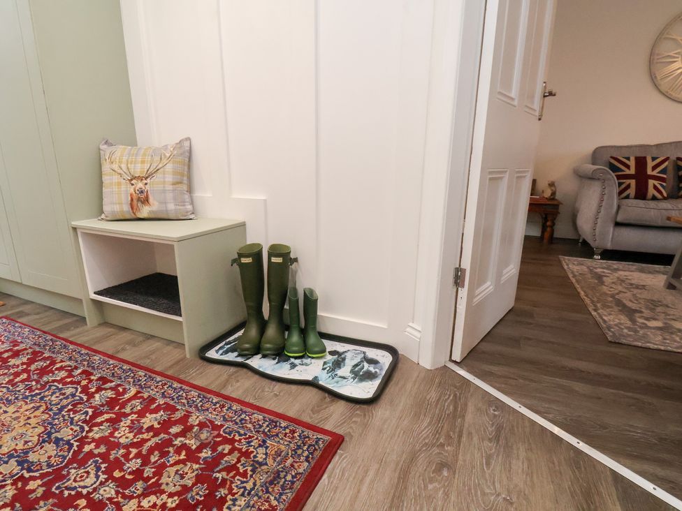 An entrance with wellies on a mat at Postman’s Lodge in Great Ayton