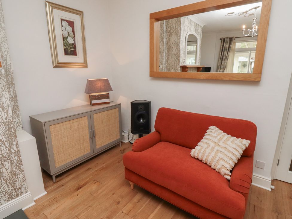 A living room with a sofa and a cabinet at 5 Jackson Terrace Morpeth