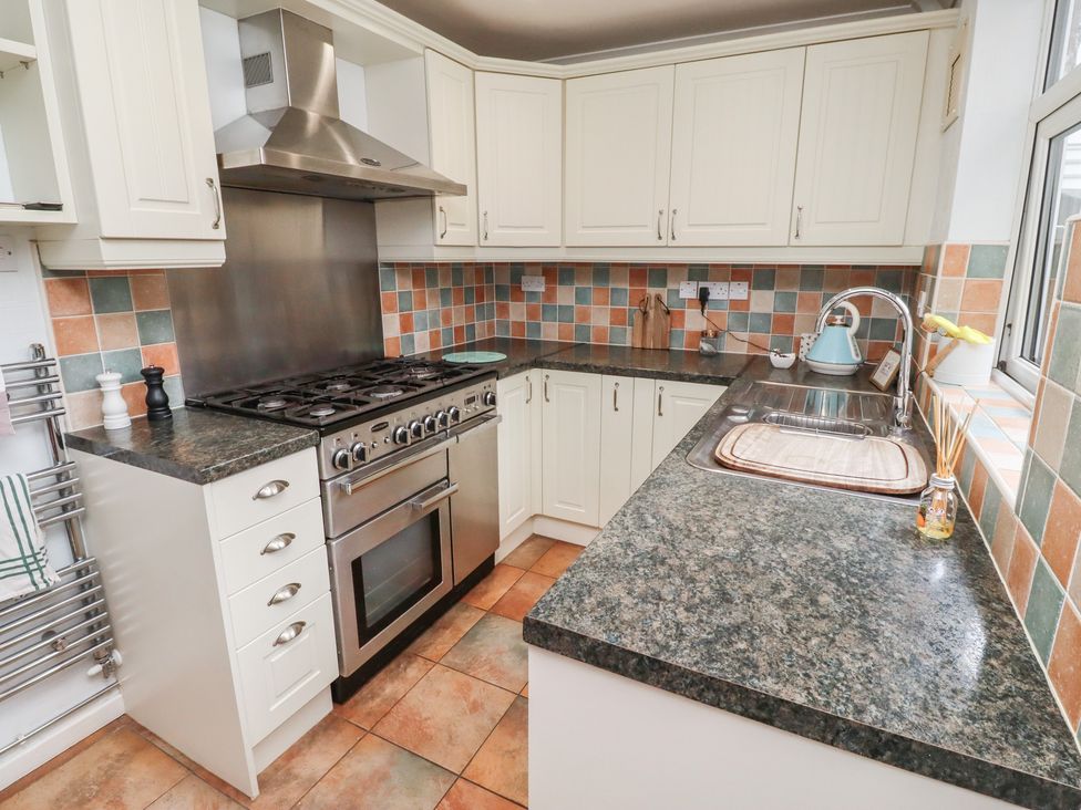 A kitchen with cabinets, stove, sink and countertop at 5 Jackson Terrace, Morpeth