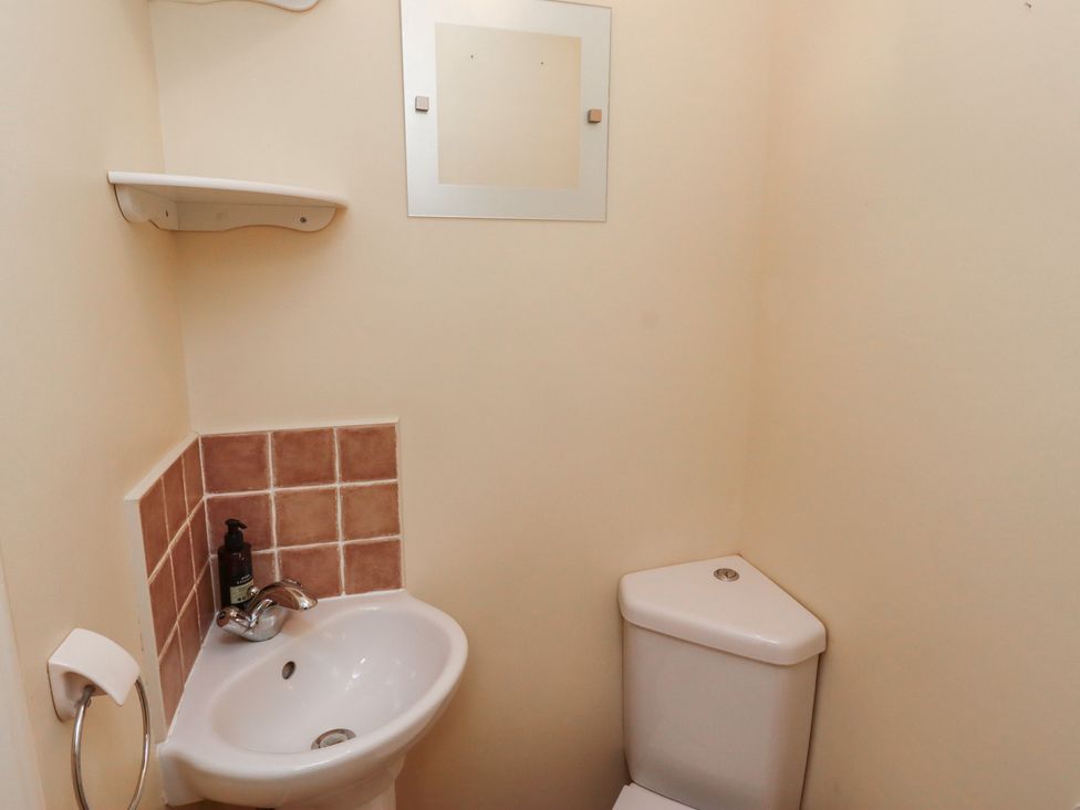 A small bathroom with a sink and toilet at 5 Jackson Terrace Morpeth