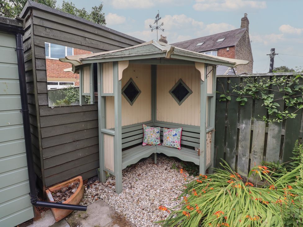 A garden shelter with seating and pillows at 5 Jackson Terrace in Morpeth