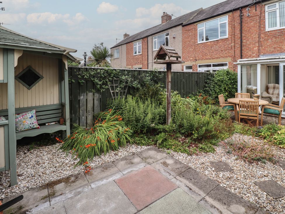 A garden with plants and seating area at 5 Jackson Terrace Morpeth