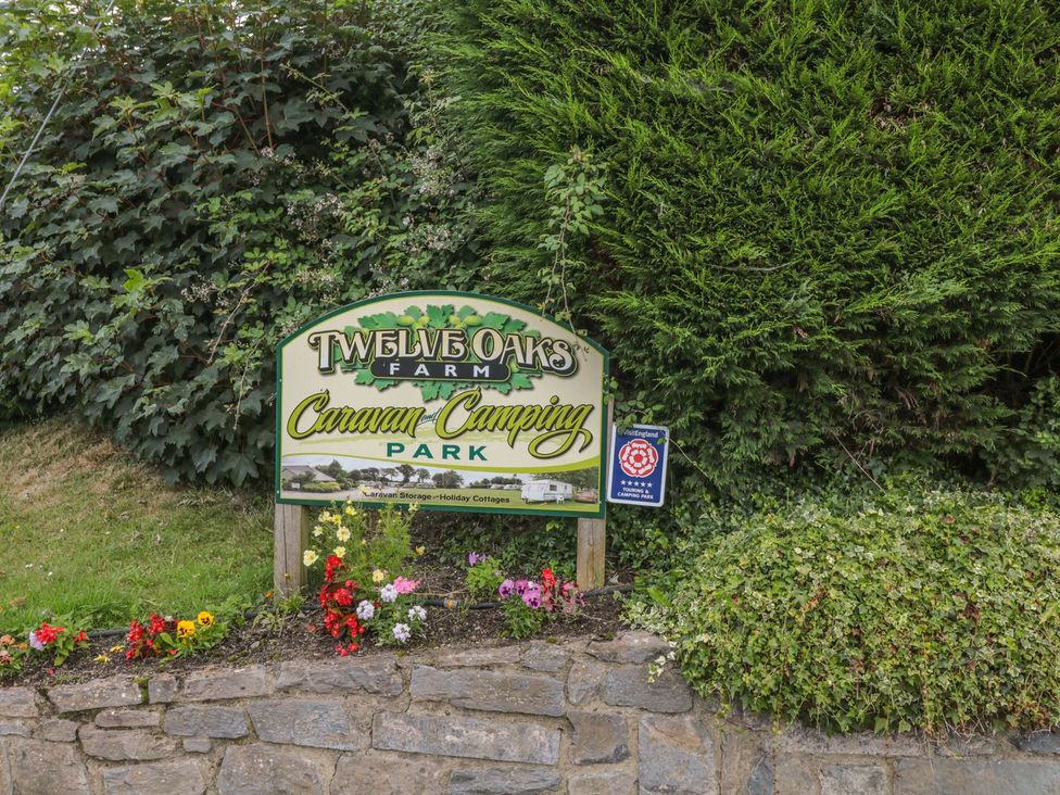 A sign for Twelve Oaks Farm Caravan Camping Park at Maple Lodge Teigngrace near Kingsteignton