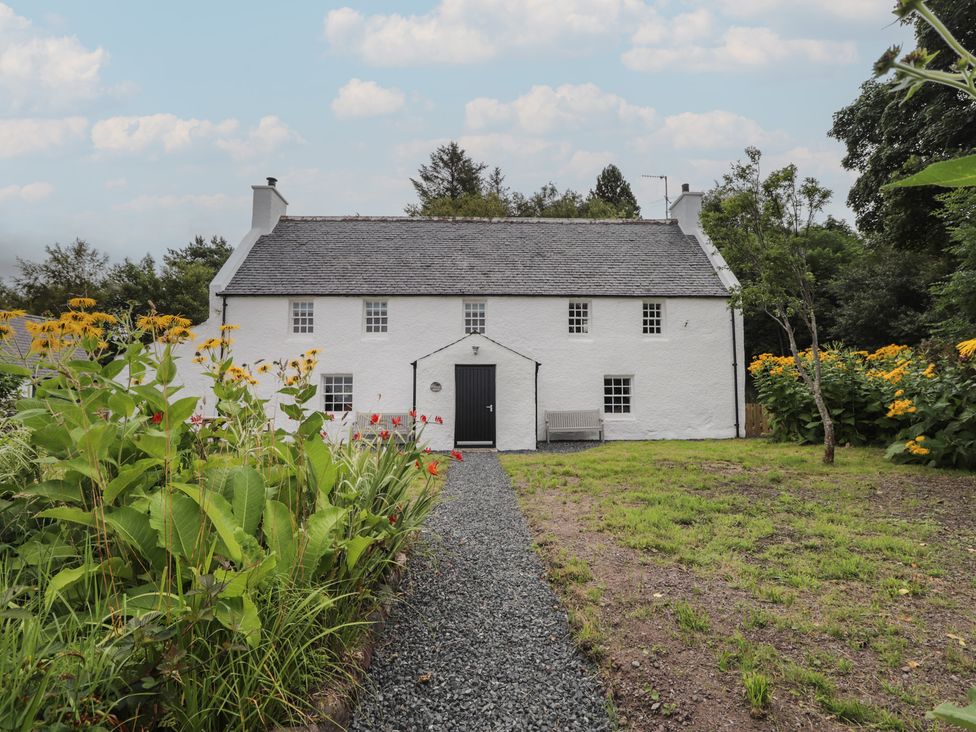 A house with a pathway and flowers at Sron Dubh in Achnasheen