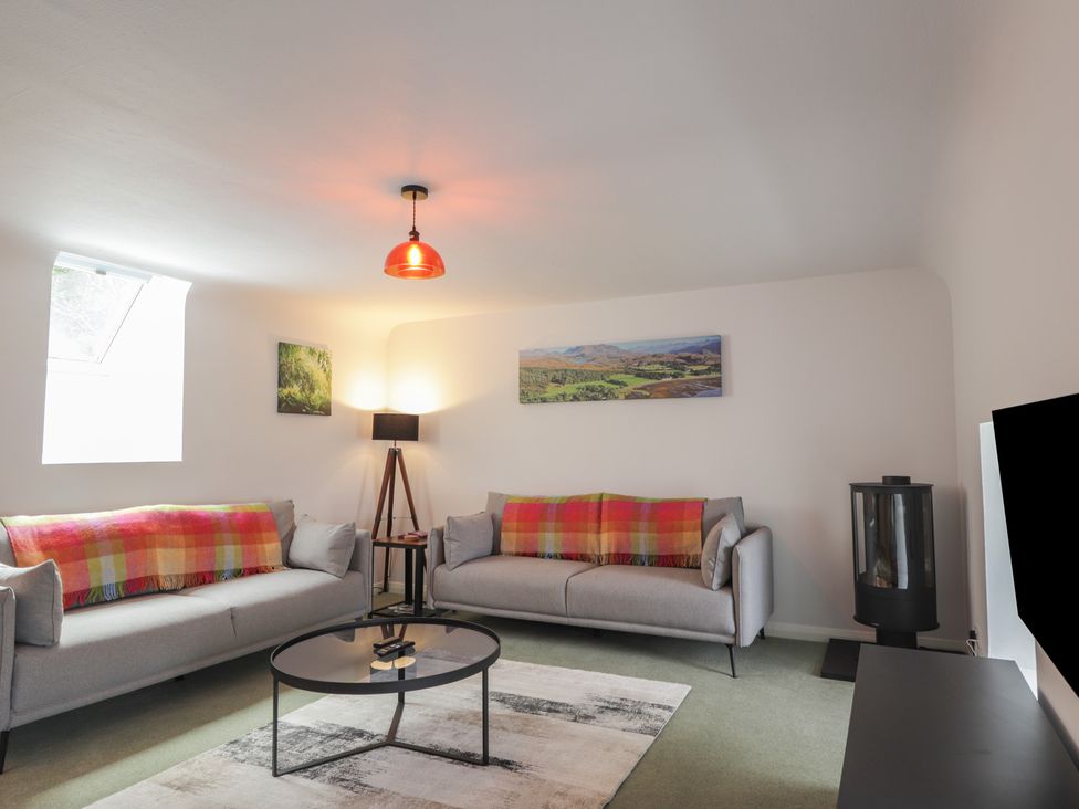 A living room with sofas and a coffee table at Sron Dubh in Achnasheen