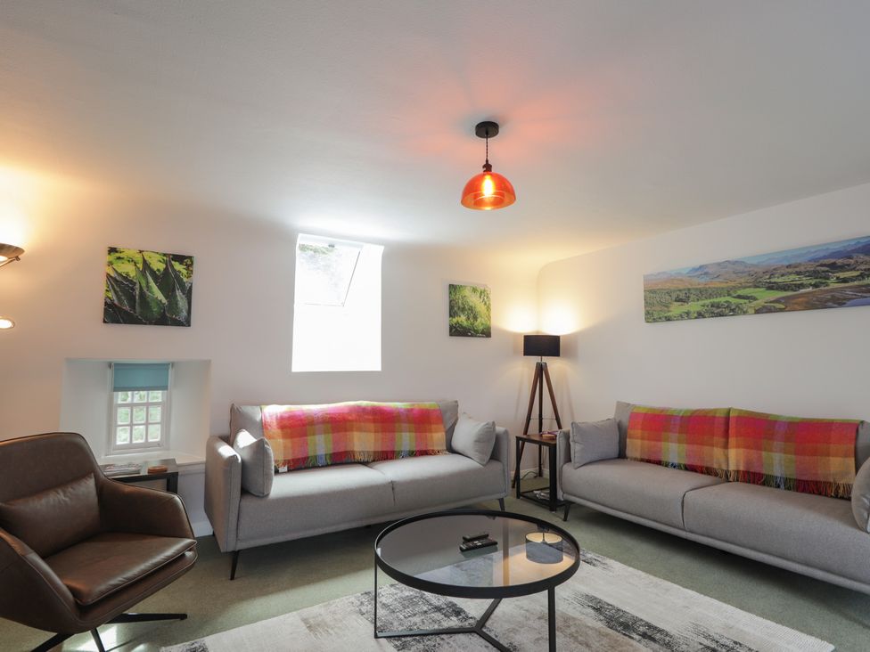 A living room with sofas and artworks at Sron Dubh Achnasheen