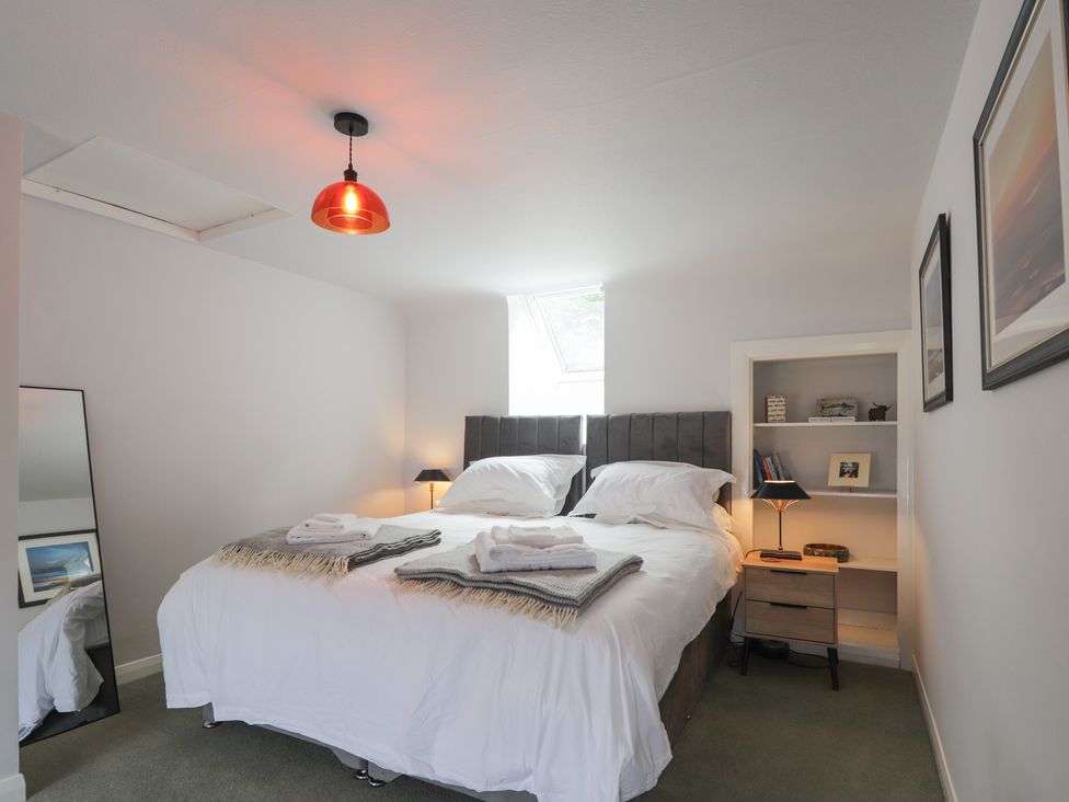 A bedroom with a bed and bedside table at Sron Dubh Achnasheen