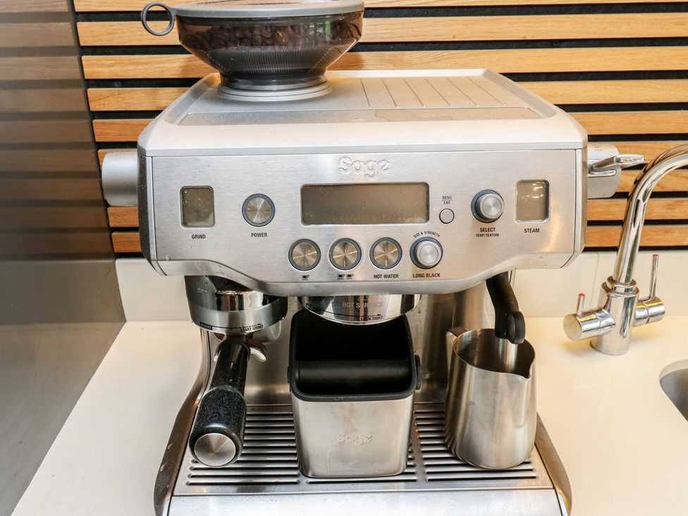 An espresso machine and accessories at 20 Overland Crescent in Apperley Bridge