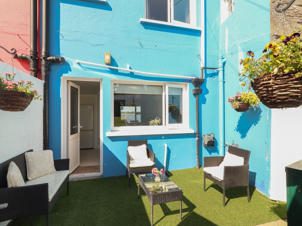 An outdoor seating area with chairs and a table at 1 Windermere in Kinvara, County Galway