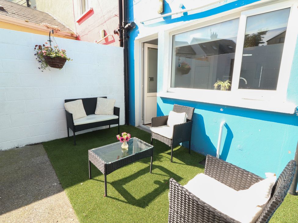 An outdoor patio with seating and a table at 1 Windermere, Kinvara, County Galway