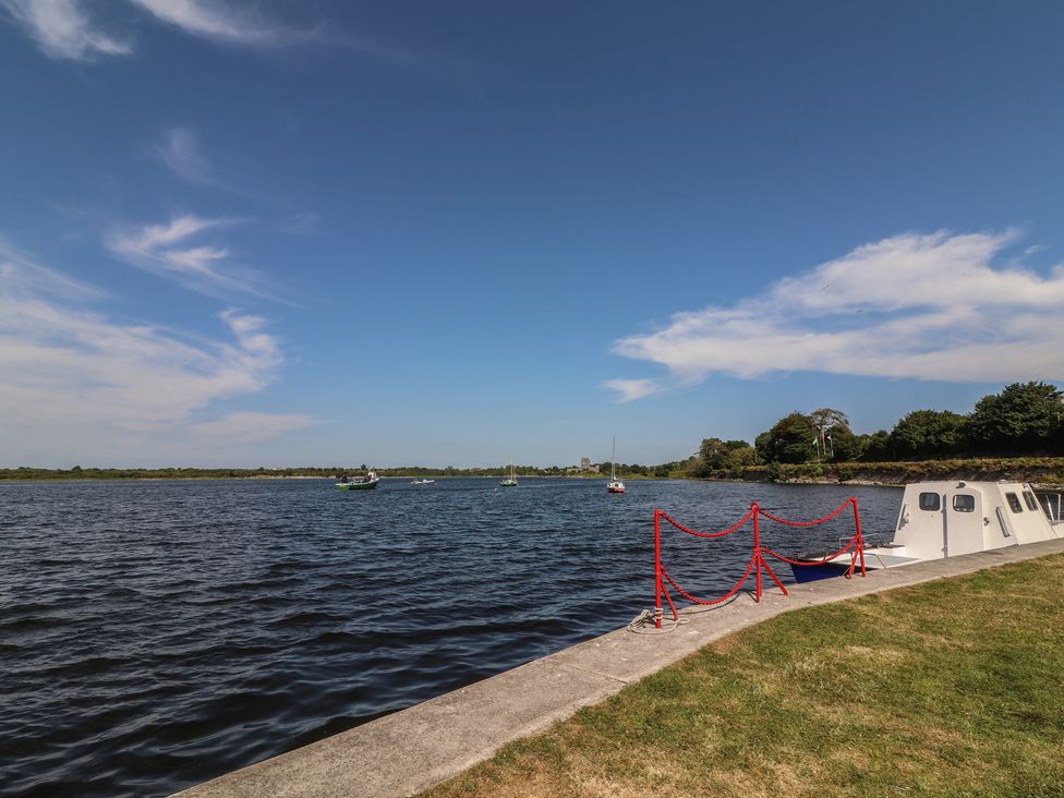 A view of water with boats and a pier at 1 Windermere, Kinvara, County Galway