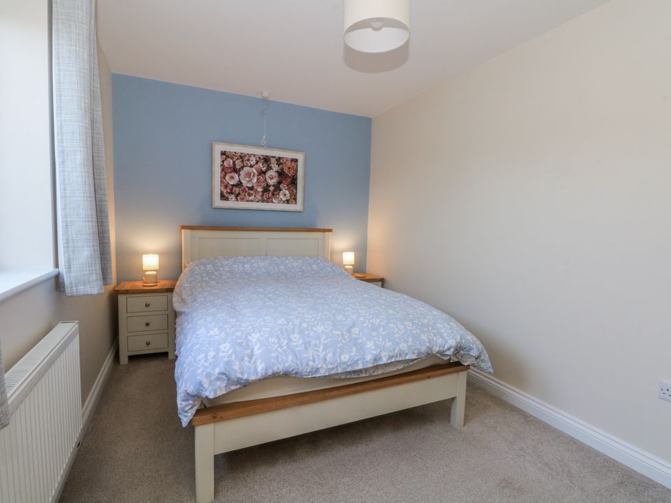 A bedroom with a bed and bedside tables at The Annexe in Caverswall