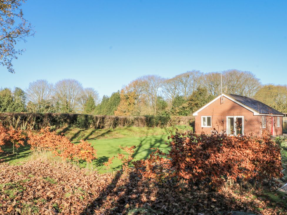 A house surrounded by grass and trees at The Annexe in Caverswall