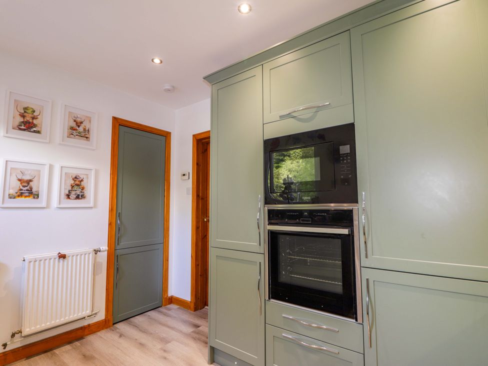 A kitchen with an oven and microwave at The Highlander in Dornie