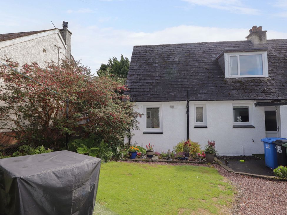 A house with a garden and plants at The Highlander in Dornie