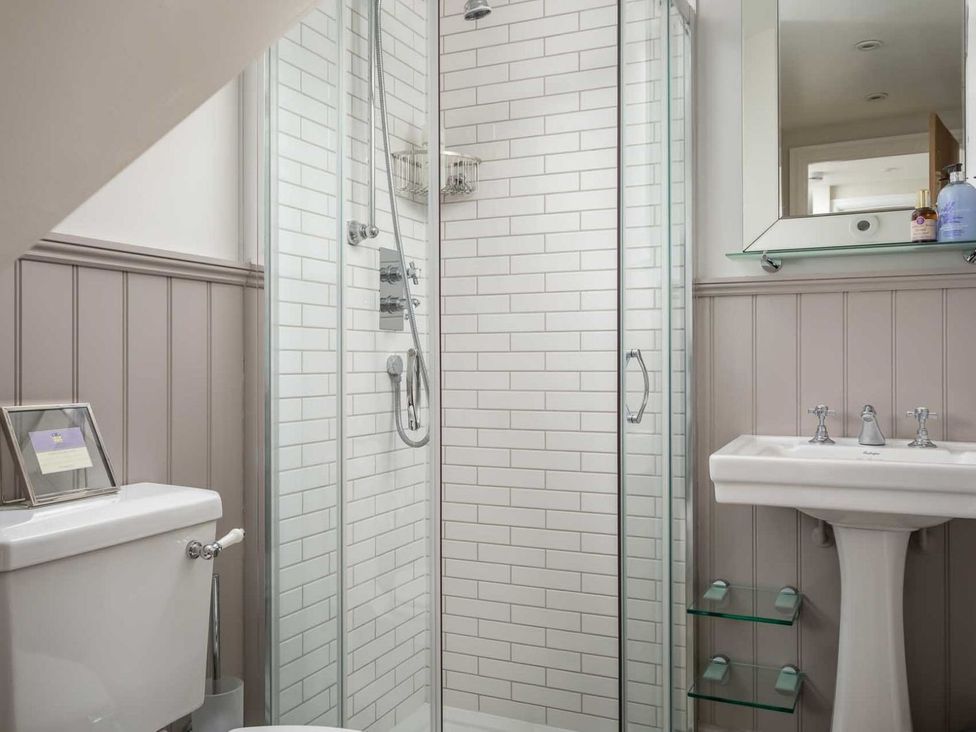A bathroom with a shower and sink at Lavender Cottage (Stow-on-the-Wold) Cheltenham