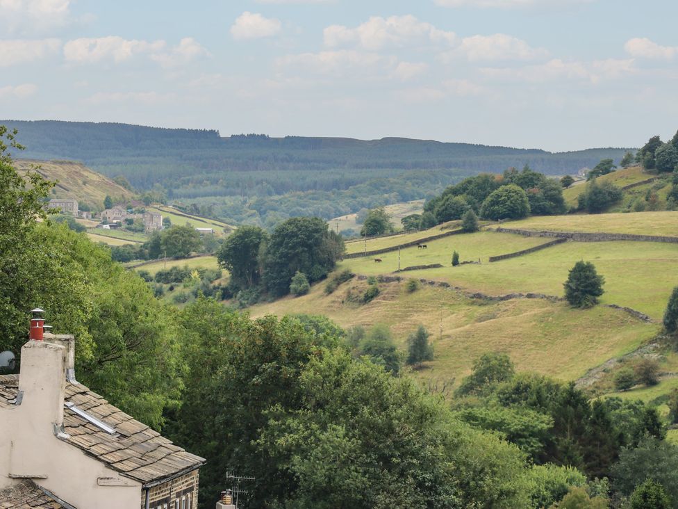A view of countryside with hills and trees at 6 Well Hill Holmfirth