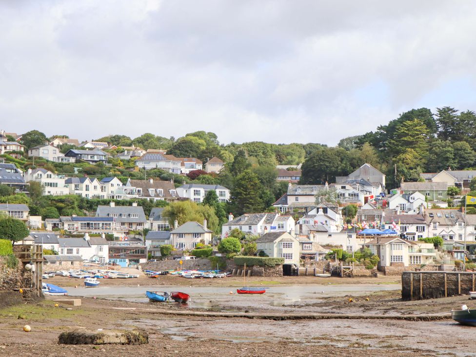 A seaside view with houses and boats at The Porthole in Newton Ferrers
